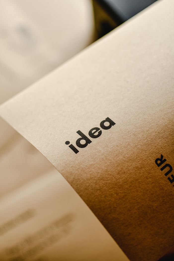 Services Close-up shot of the word 'idea' printed on brown paper, perfect for representing creativity and startups.